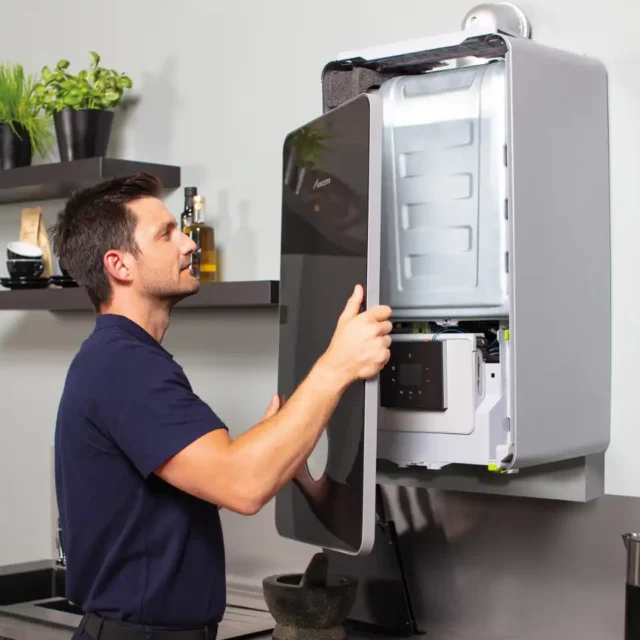 Photo of an AMS engineer serving a boiler - servicing & repair service