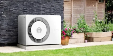 Photo of a heat pump installation on the side of a property